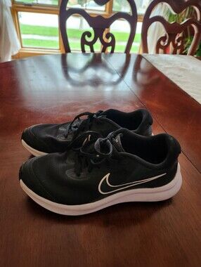 Nike Men’s Black Running Shoes with White Swoosh